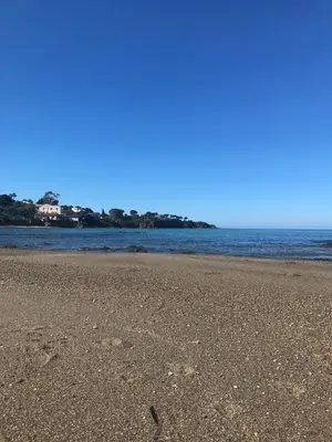 a sandy beach with the ocean in the background at Le Terrazze sul Mare - Capo Aranciotto Beach in Cefalù