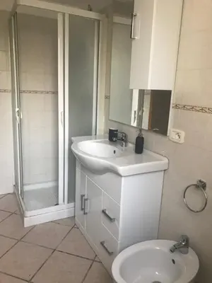 a bathroom with a sink and a toilet and a shower at Le Terrazze sul Mare - Capo Aranciotto Beach in Cefalù