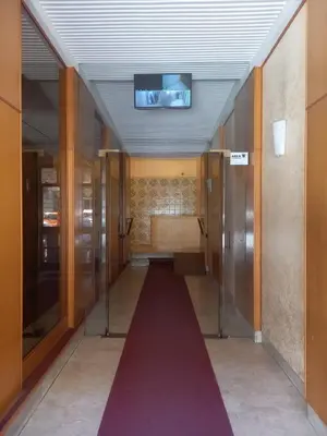 a hallway with a red carpet in a building at Casa del Cioccolato in Palermo