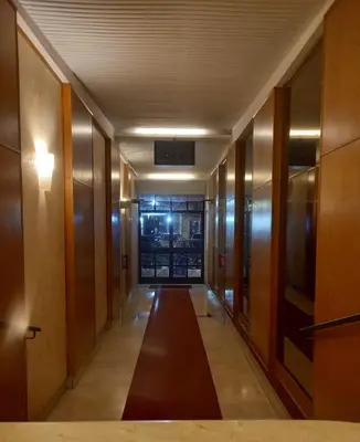 a hallway of a building with doors and a hallwayngth at Casa del Cioccolato in Palermo