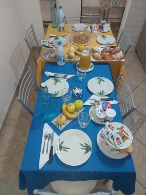 a blue table with plates of food on it at B&B D'Amico87 in Bagheria