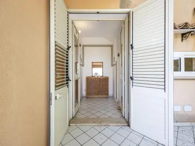 a corridor of a house with a door open at Apartment Cicladi Milos by Interhome in Santa Flavia