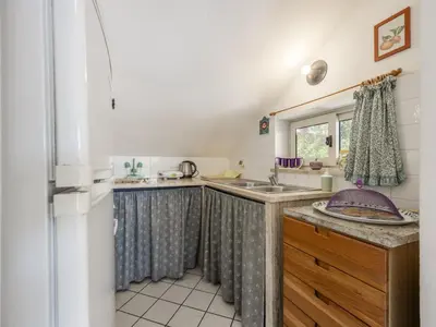 a small kitchen with a sink and a window at Apartment Cicladi Milos by Interhome in Santa Flavia