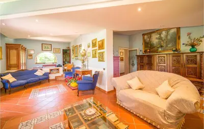 a living room with a couch and a table at Beautiful Home In Partinico Pa in Balestrate