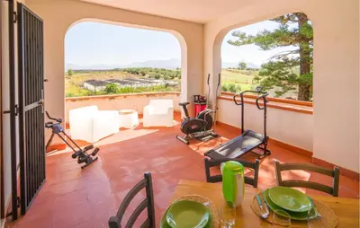 a living room with a table and a room with a view at Beautiful Home In Partinico Pa in Balestrate