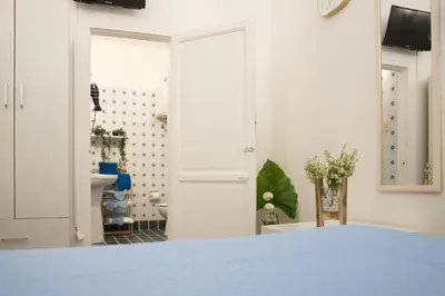 a room with a bathroom with a sink and a toilet at Voilà Rooms Guest House in Terrasini