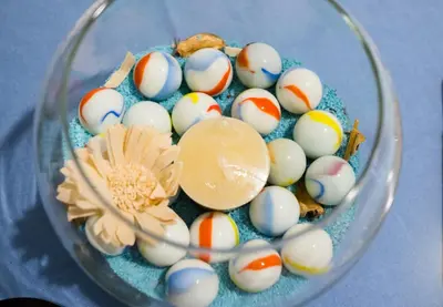 a glass bowl filled with easter eggs on a table at A Casa Di Lilly in Palermo