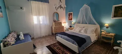 a bedroom with a bed with a canopy at A Casa Di Lilly in Palermo