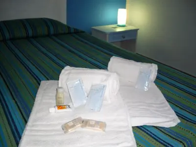a bed with towels and toothbrushes on it at Nonna Giò House in Castellammare del Golfo