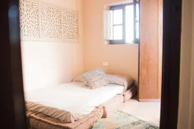 a small bed in a room with a window at Chibedda Dimora Cesca in Castellammare del Golfo