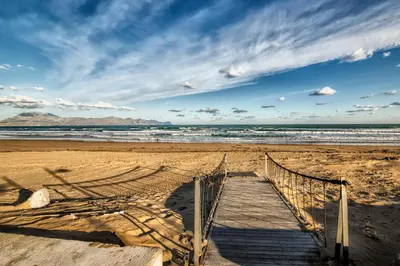 a beach with a volleyball net in the sand at Light Blue in Balestrate