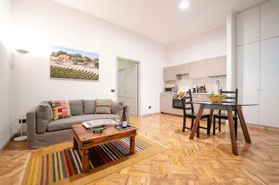 a living room with a couch and a table at Palazzo Planeta in Palermo