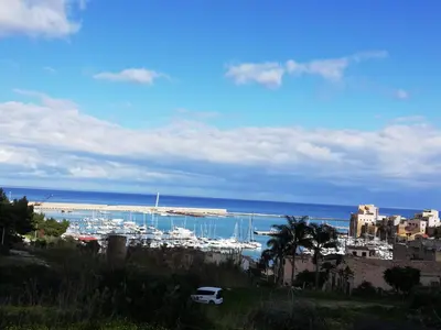 a view of a harbor with boats in the water at Monolocale La Chicca in Castellammare del Golfo