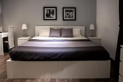 a bedroom with a large bed with two night stands at Palermo al Centro - Appartamento Maestri in Palermo