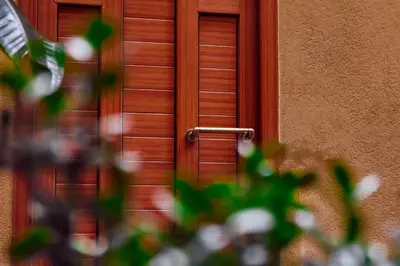 a wooden door with a handle in front of a building at Palermo al Centro - Appartamento Maestri in Palermo