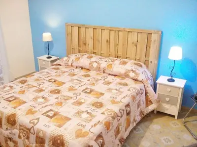 a bedroom with a large bed and two night stands at I Cinque Continenti in Palermo