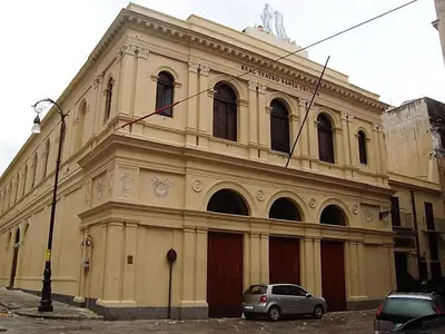 a building with a car parked in front of it at I Cinque Continenti in Palermo