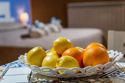 a bowl of oranges and lemons on a table at Antico Canale in Castellammare del Golfo