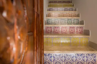 a set of stairs with colorful tiles on them at Antico Canale in Castellammare del Golfo