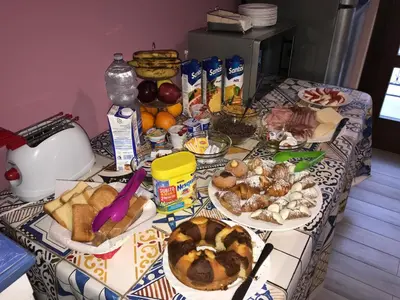 a table topped with plates of bread and other foods at Antico Canale in Castellammare del Golfo