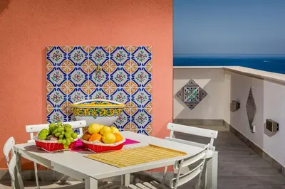 a table with two baskets of fruit on it at Antico Canale in Castellammare del Golfo