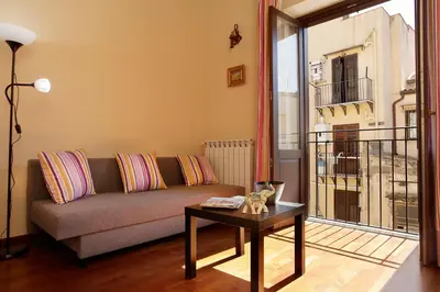 a living room with a couch and a table at Casa Matrangela in Palermo