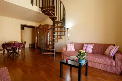 a living room with a couch and a table at Casa Matrangela in Palermo