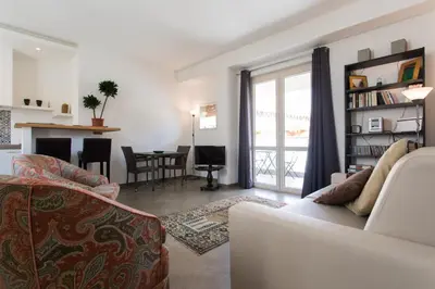 a living room with a couch and a table at Overseas - Penthouse with terrace - Attico - Palazzo San Matteo in Palermo