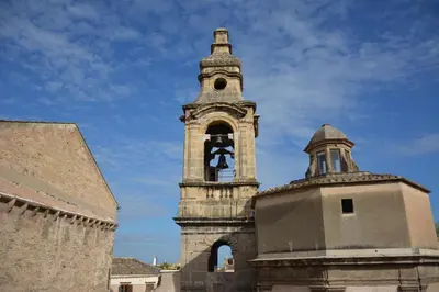 an old tower with a clock on top of a building at Overseas - Penthouse with terrace - Attico - Palazzo San Matteo in Palermo