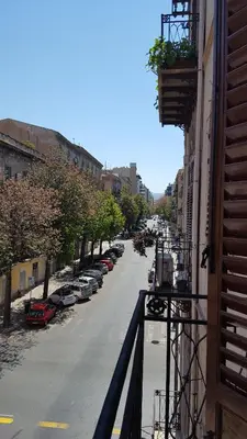 a view from a balcony of a street with parked cars at CasaLù in Palermo