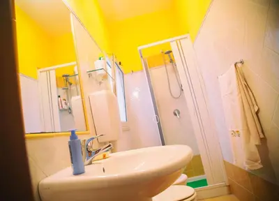 a bathroom with a sink and a shower and a toilet at B&B Il Girasole in Balestrate
