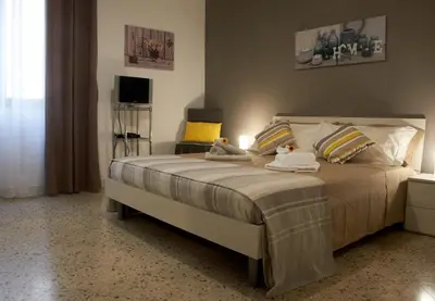 a bedroom with a large bed with two stuffed animals on it at Casa Gaia Palermo in Palermo