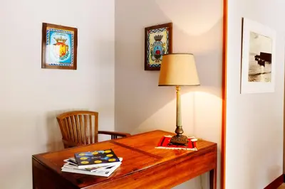 a desk with a lamp on top of it at Villa Sole in San Vito lo Capo