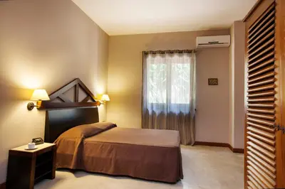 a hotel room with a bed and a window at Villa Sole in San Vito lo Capo