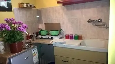 a small kitchen with a sink and a tub at Millimetro in Palermo