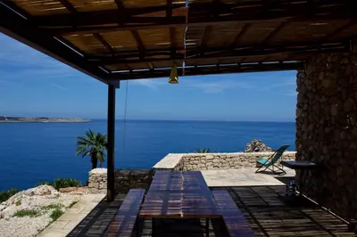 a patio with a view of the ocean at Villa Firriato in San Vito lo Capo