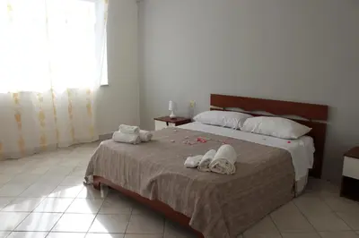 a bedroom with a bed with towels on it at Casa Timpanella in Partinico