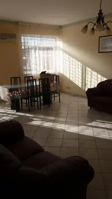 a living room with a couch and a table at Casa Timpanella in Partinico