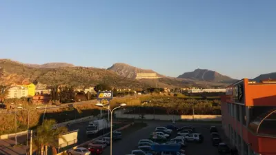 a view of a parking lot with mountains in the background at Casa Timpanella in Partinico