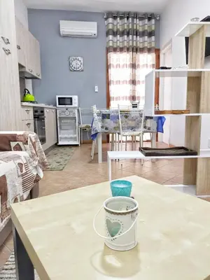 a kitchen with a table with a bowl on it at Casa vacanza Nicuzza in Castellammare del Golfo