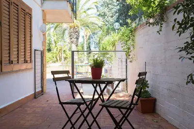 a table and chairs sitting on a patio at Piccola Oasi in Mondello