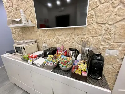 a kitchen counter with food and a microwave at Ri.Mo's Rent Room in Palermo