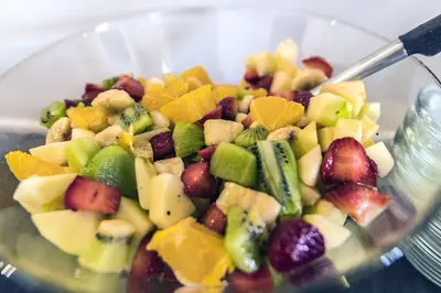 a bowl filled with a salad of fruits and vegetables at Casa Nostra B&B in Palermo