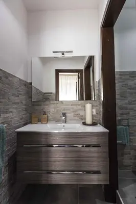 a bathroom with a sink and a mirror at Casa Nostra B&B in Palermo