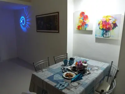 a dining room table with a plate of food on it at Casa Principe Maqueda in Palermo