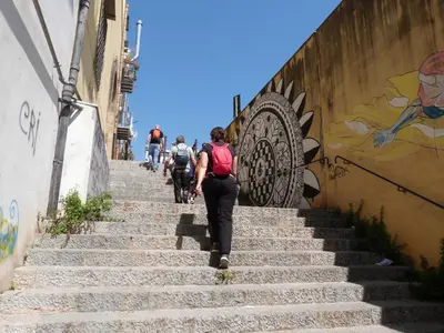 a group of people walking up some stairs at Casa Principe Maqueda in Palermo