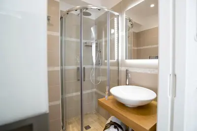 a bathroom with a sink and a shower at Il Mare Dentro Rooms in San Vito lo Capo