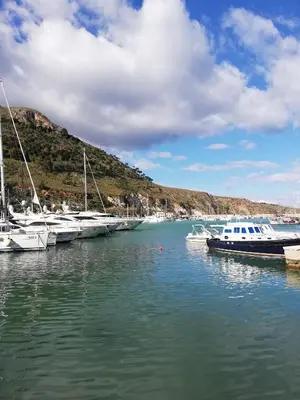 a bunch of boats are docked in a harbor at Appartamenti La Stella in Castellammare del Golfo
