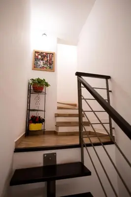 a staircase in a house with a potted plant at Quattro Incanti in Palermo