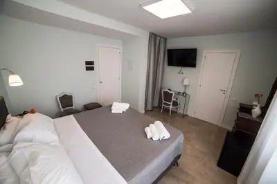 a bedroom with a bed with two towels on it at B&B Attico 33 in Palermo